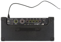 Black guitar amplifier with control panel and cable on a white background