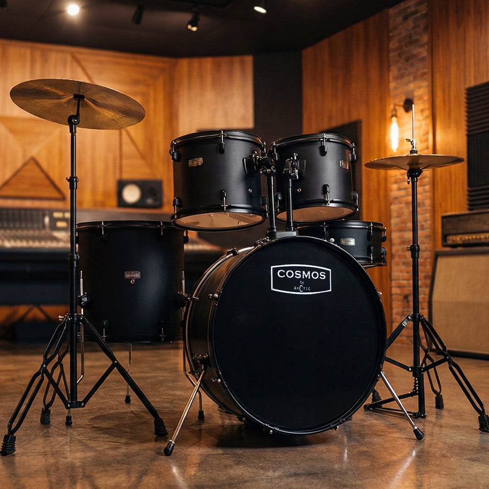 High-angle studio shot of a glossy black 5-piece acoustic drum set showcasing the hardware setup, white drumheads, and reflective chrome hoops.