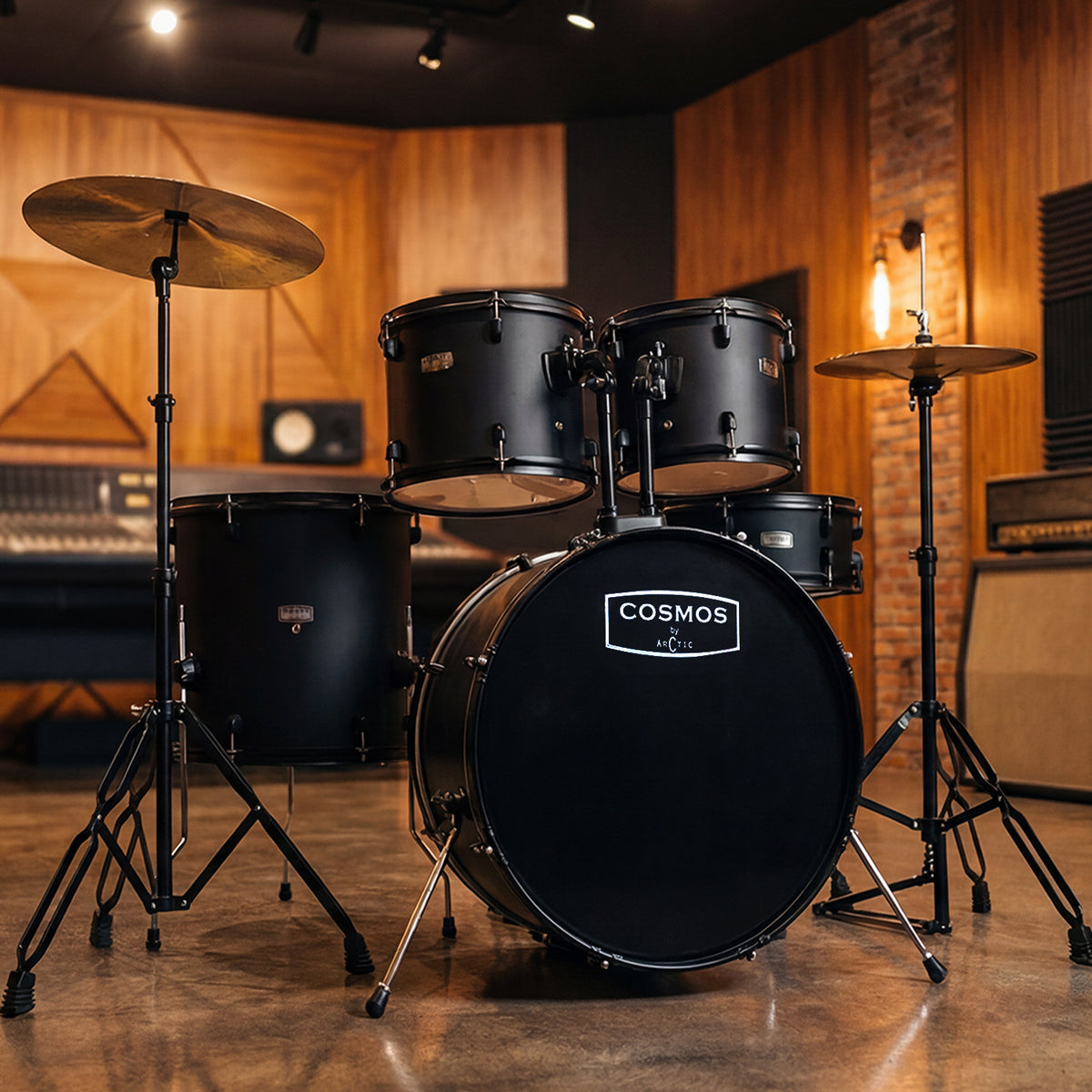 High-angle studio shot of a glossy black 5-piece acoustic drum set showcasing the hardware setup, white drumheads, and reflective chrome hoops.