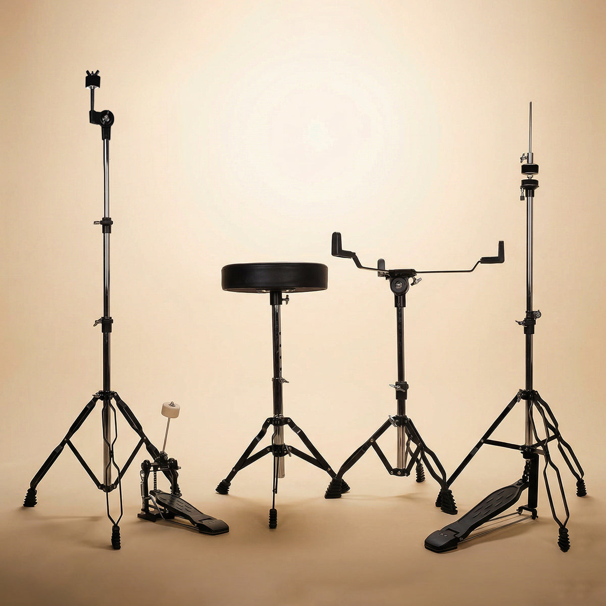 Behind-the-kit view of a black acoustic drum set, showcasing the layout from a drummer's perspective, including the snare stand, kick pedal, and drum throne.