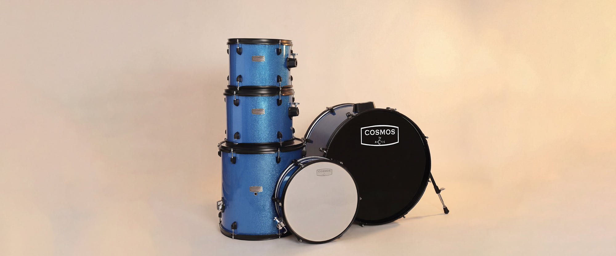 Close-up shot focusing on the high-gloss blue finish of the tom shells, chrome rims, and polished tension rods for desktop views.