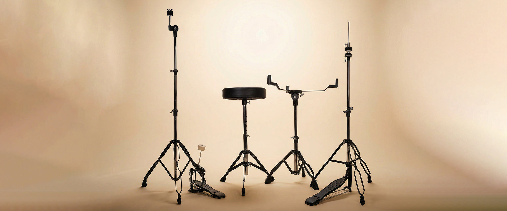 Drummers perspective desktop banner shot of the glossy blue 5-piece drum kit, highlighting the placement of the pedals, snare drum, and cymbals.