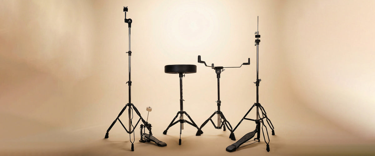 Drummers perspective desktop banner shot of the glossy blue 5-piece drum kit, highlighting the placement of the pedals, snare drum, and cymbals.
