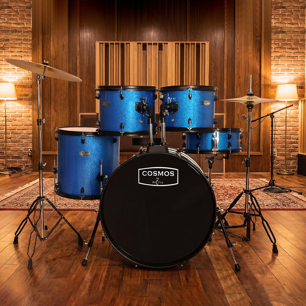 Side profile of a deep blue acoustic drum kit, showcasing the sturdy double-braced stands, hi-hat pedal, and overall build quality.