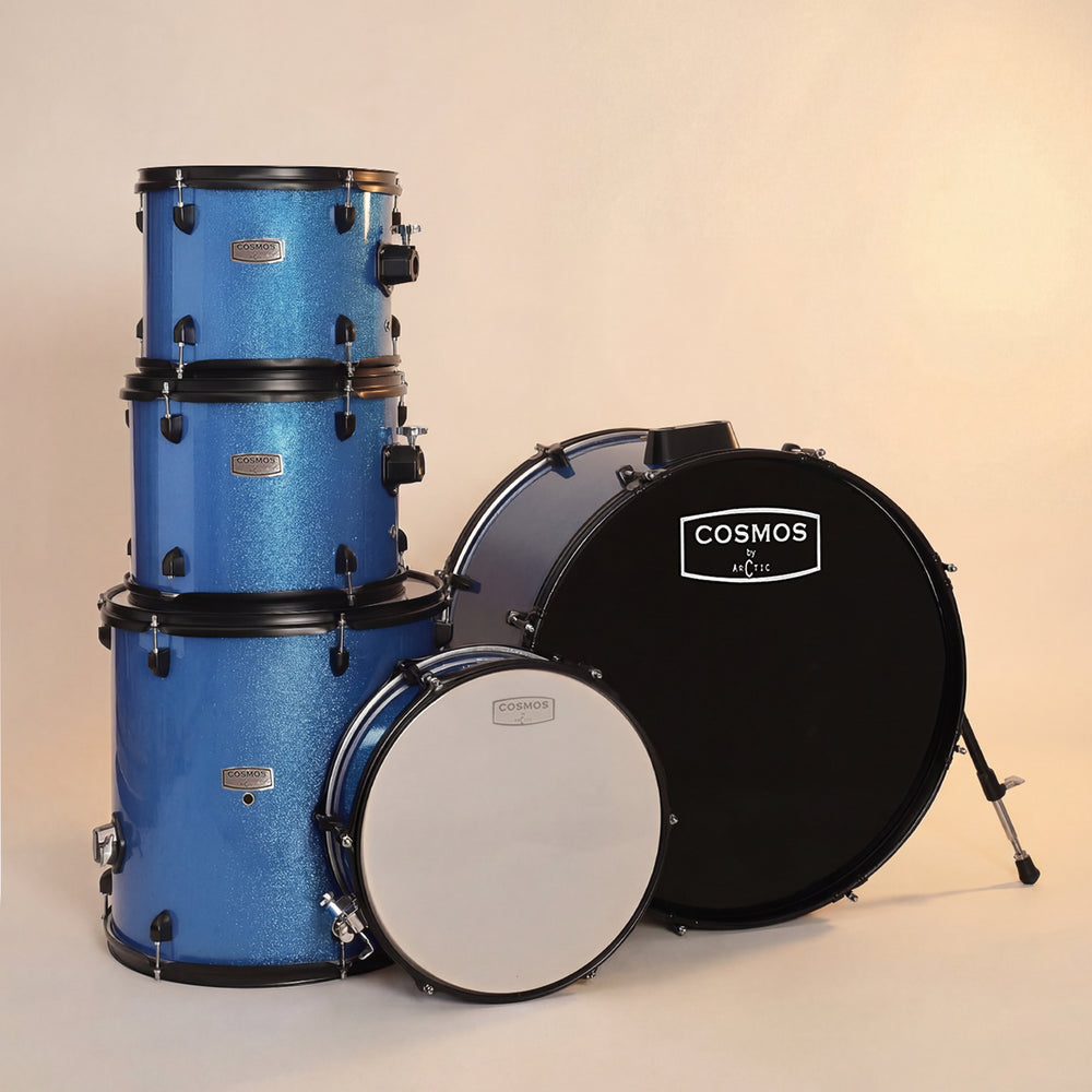 Close-up shot focusing on the high-gloss blue finish of the tom shells, chrome rims, and polished tension rods.