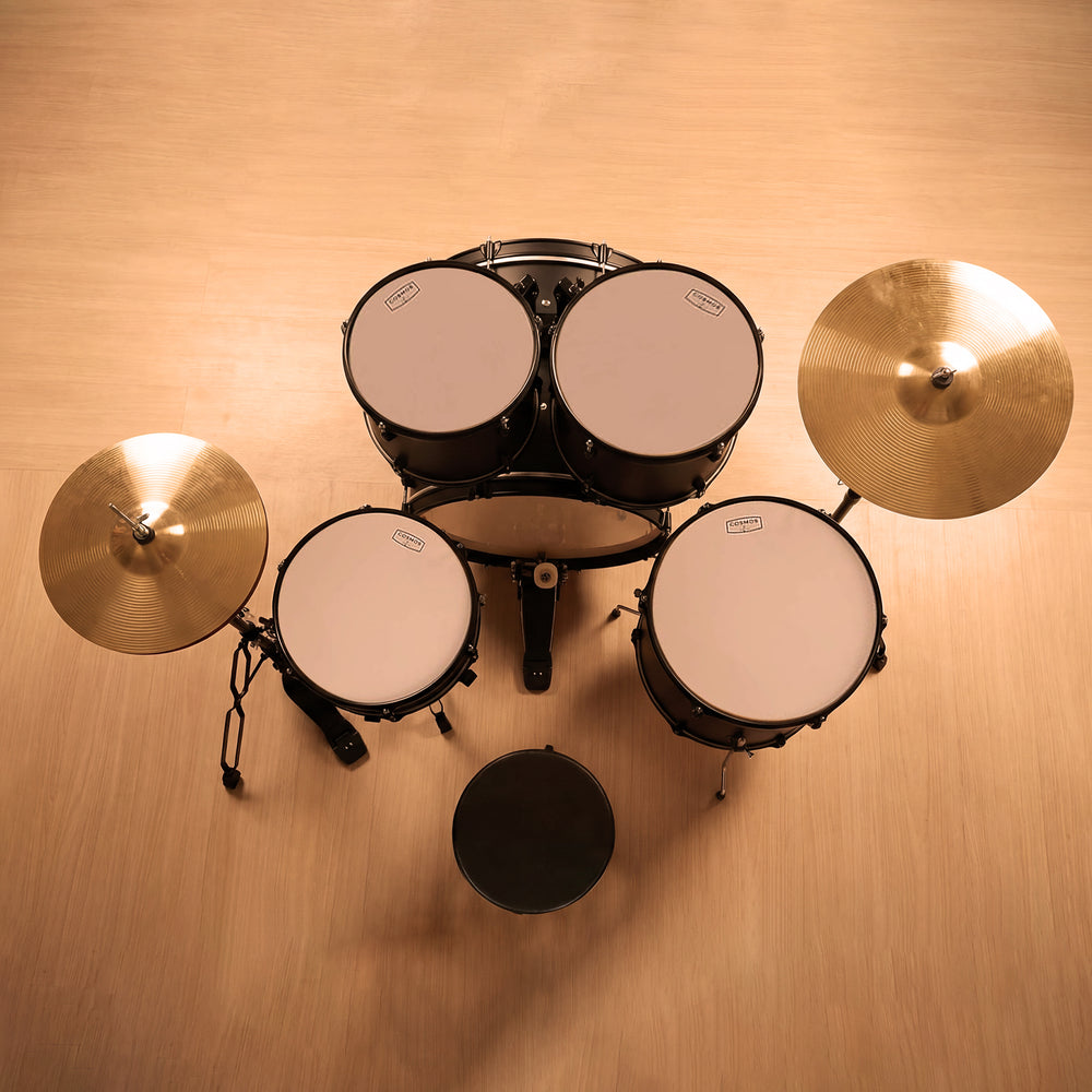 Side profile view of a black 5-piece drum kit, focusing on the durability of the double-braced stands and bass drum spurs.