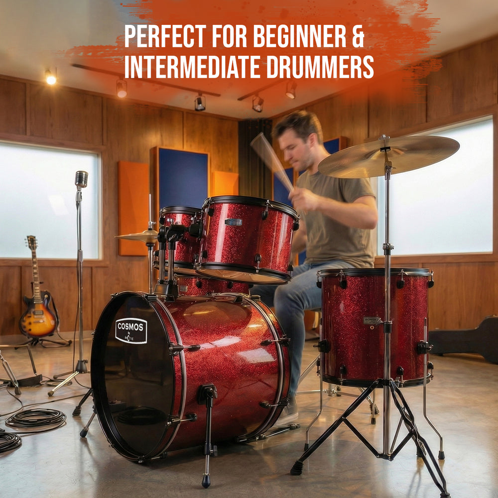 Side profile shot of the red acoustic drum set, focusing on the double-braced cymbal and hi-hat stands.