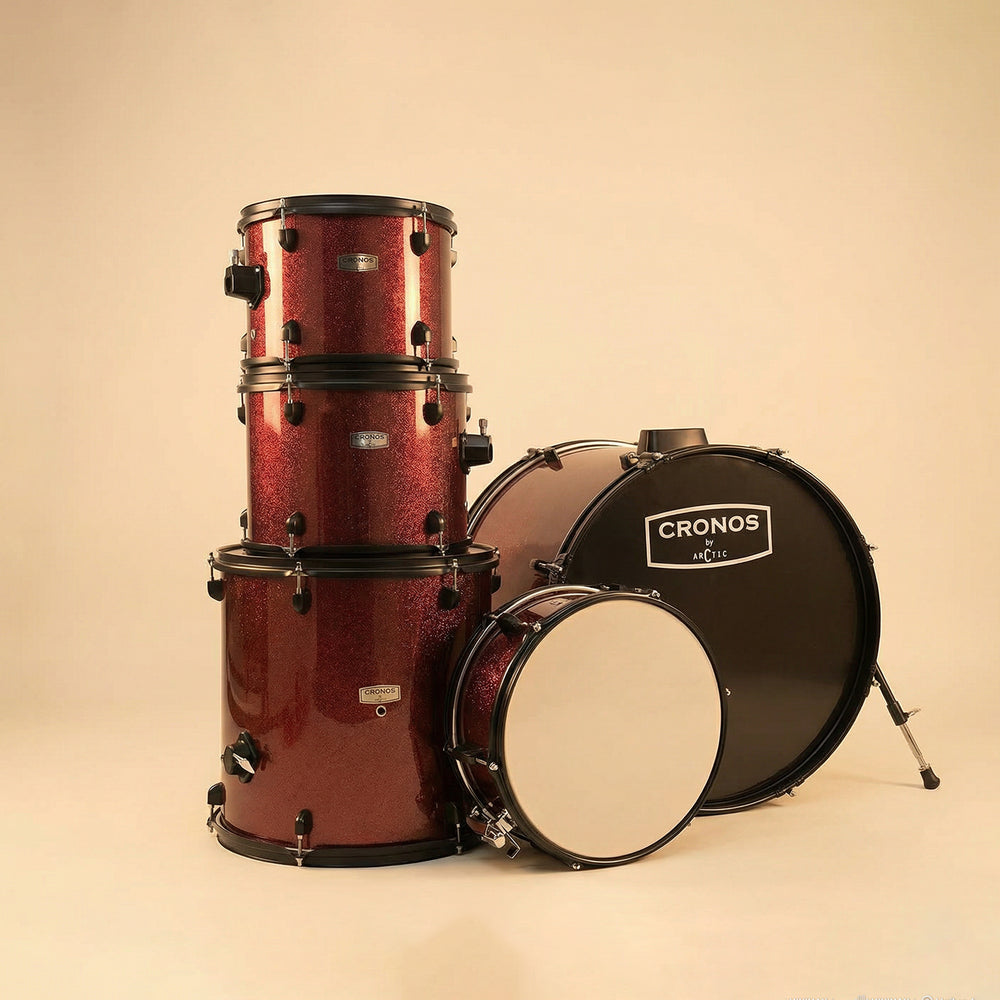 Close-up detail shot of the metallic red drum kit shells, showing the crisp white drumhead and polished chrome mounting system.