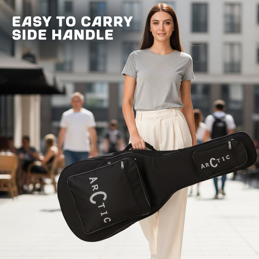 Woman holding a black guitar case with 'Arctic' branding in an urban setting.