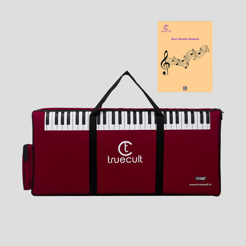 Red keyboard case with black keys and 'truecult' branding, accompanied by a music notebook.