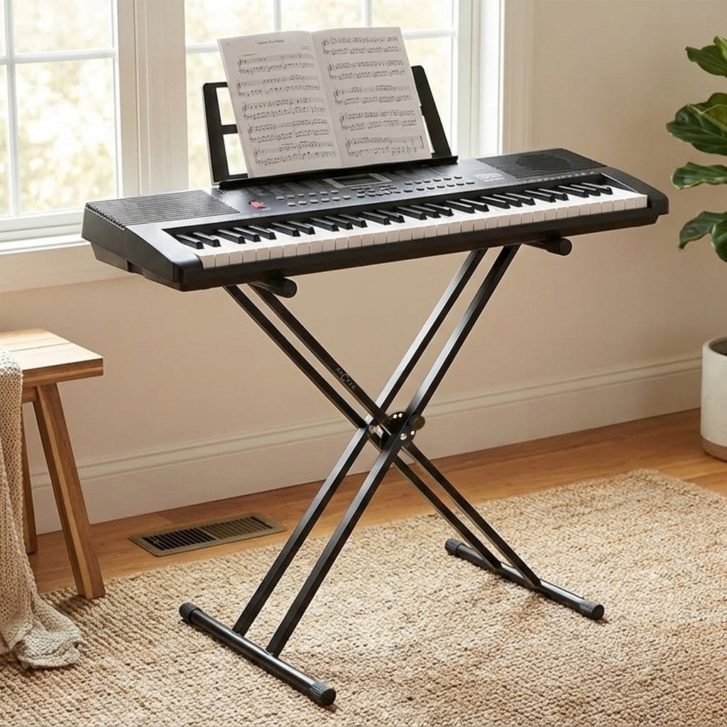 Keyboard with music stand in a room with a window and plant