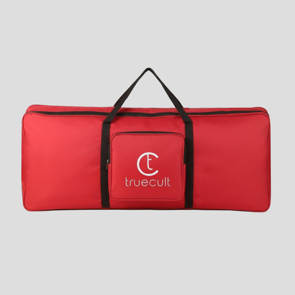 Red bag with black handles and 'truecult' logo on a white background