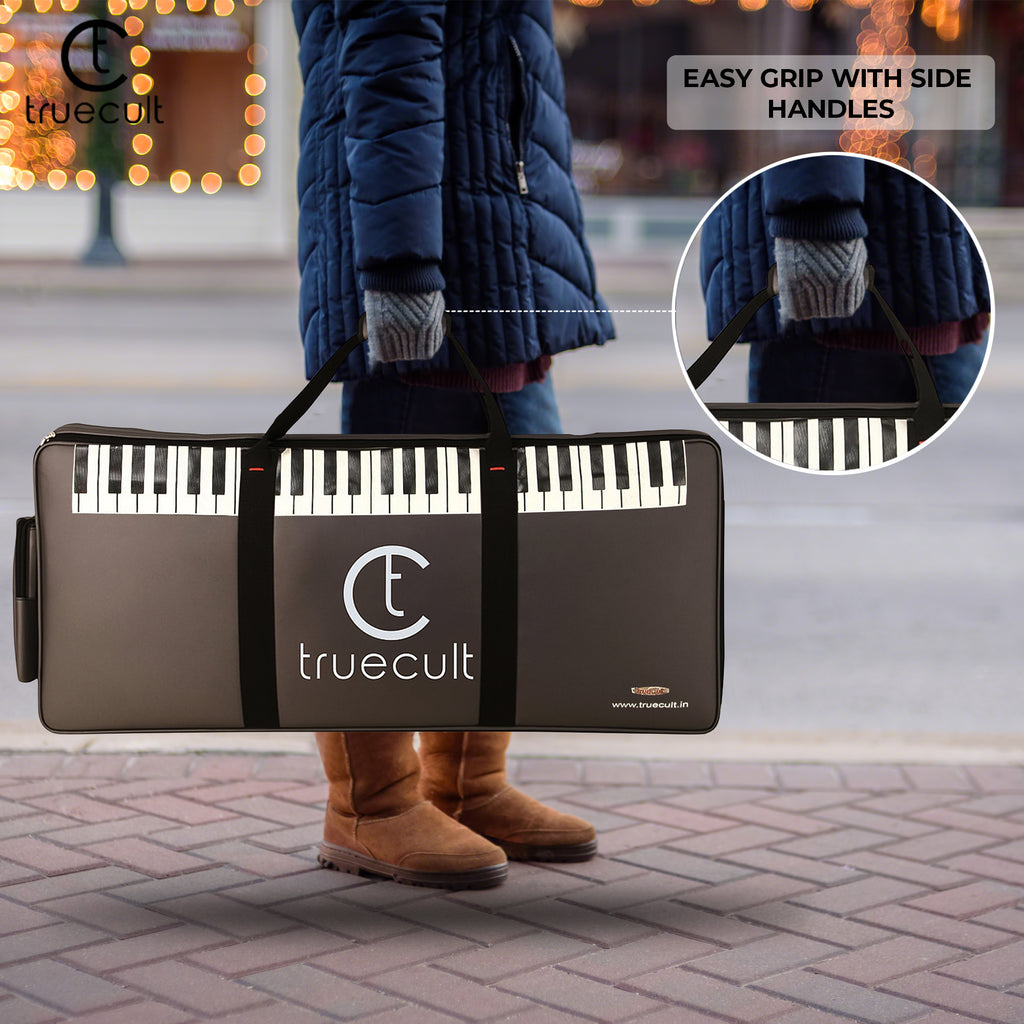 Portable keyboard case with 'truecult' branding on a city street.